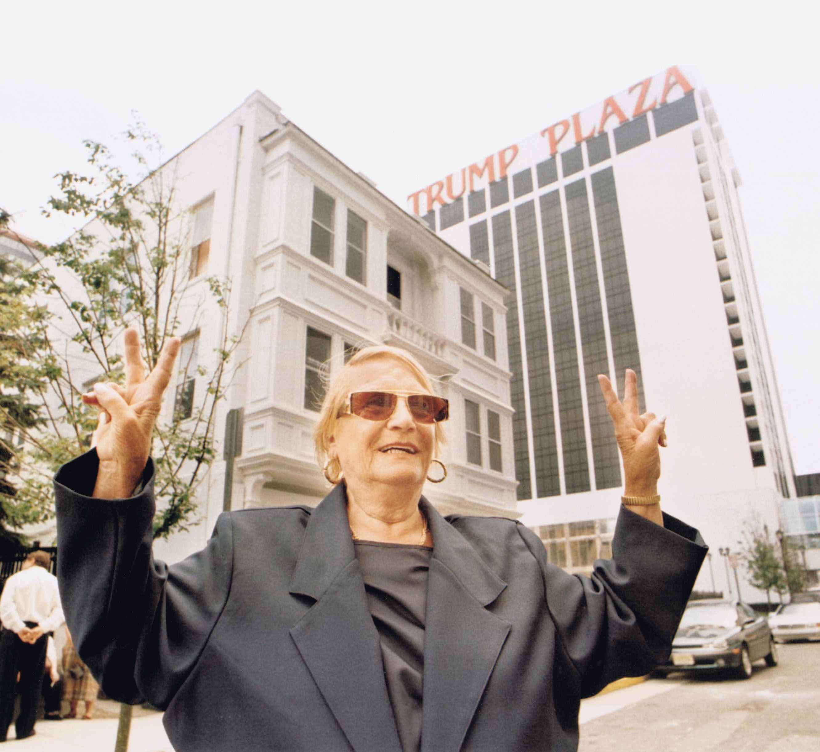 Vera Coking, who refused to sell her property to casino developers, gives the victory sign
