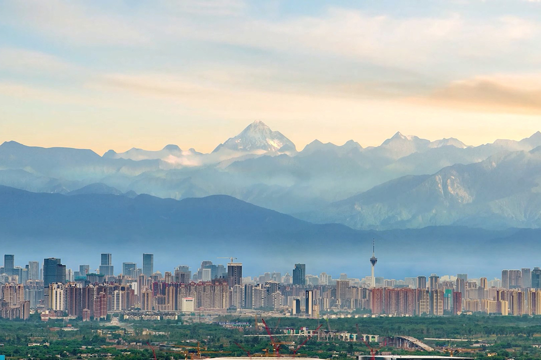 A view of Chengdu with the Tibetian Mountains in the background                                              
